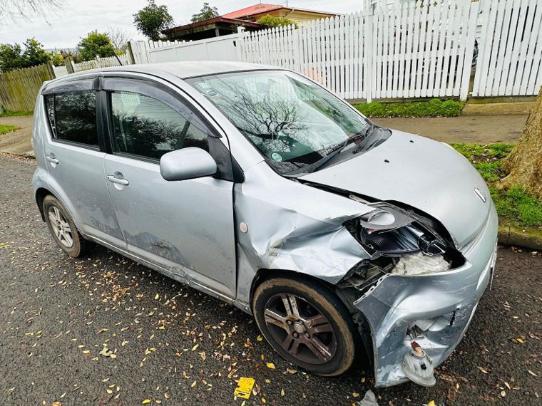 Silver hatchback with front damage bought for cash in Dunedin