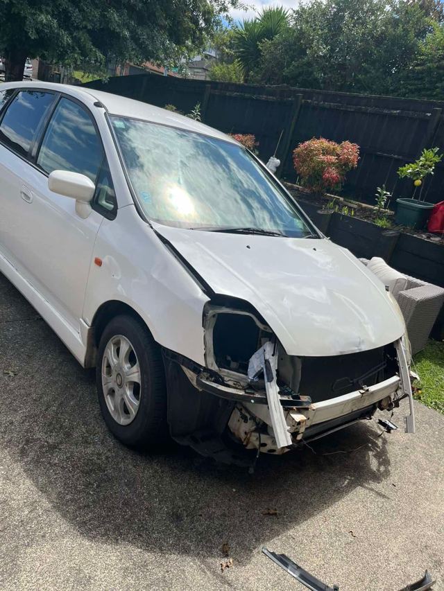 White people mover with crash damage collected for cash