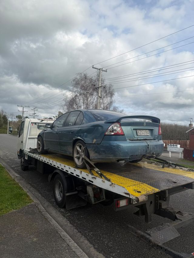 Sedan loaded on our flatbed tow truck in Dunedin